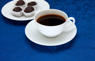 Cup of  coffee on a blue background