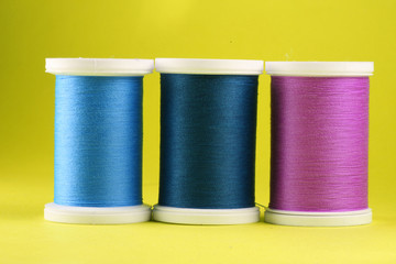 cold colors thread against yellow background