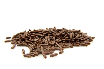 pile of Dutch chocolate sprinkles over white background