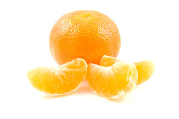 whole mandarin and parts over white background