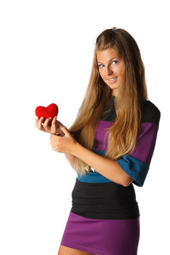 Girl with red heart in hands
