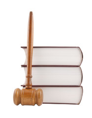 Judge's gavel and stack of legal books isolated on white