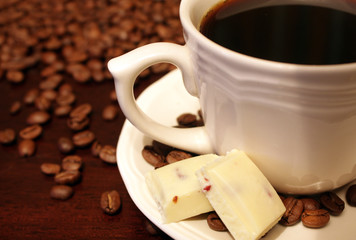 Coffee cup and chocolate pieces
