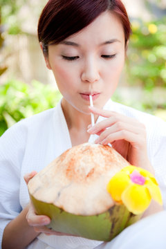 Woman Drinking Coconut