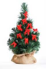 Christmas tree decorated with red bows © Maksim Shebeko