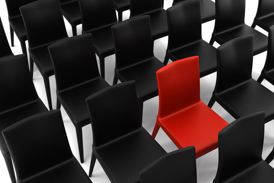 red chair among black chairs