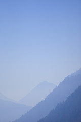Alps in Austria in a blue evening fog - 18475726
