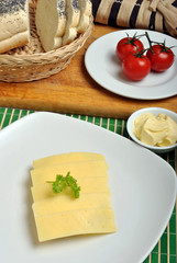 slice poppy seed bread with cheese on a plate