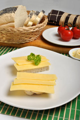 slice poppy seed bread with cheese on a plate