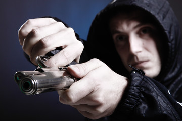 Naklejka premium Gun in your face