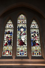 Saint Luke on stained glass in Christchurch Cathedral