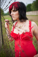caught woman behind barb wire fence