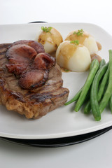 grilled rump steak and bacon with organic vegetable