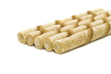 Tasty cream puffs isolated over white