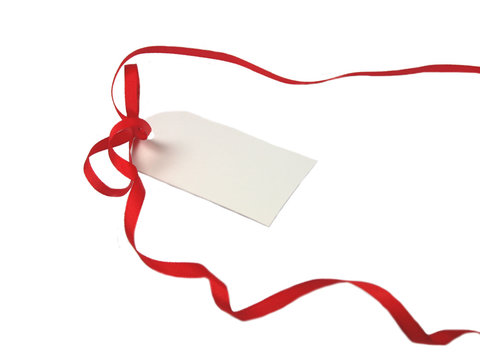 Empty gift tag with red ribbon on white background