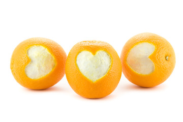 Oranges with a heart isolated on white
