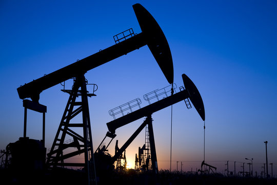 Silhouette of oil pump jacks