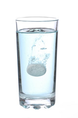 Tablet in glass on a white background
