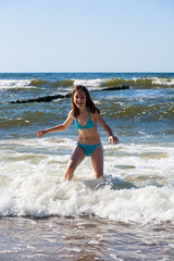 Girl playing on beach