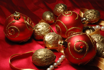 Red christmas balls and golden walnuts