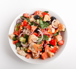 bowl of Panzanella bread salad on white background