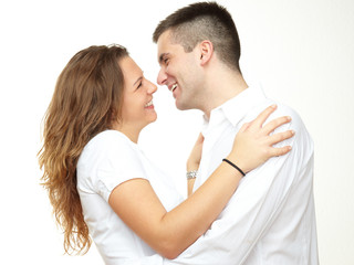 Young couple cuddling happily in love