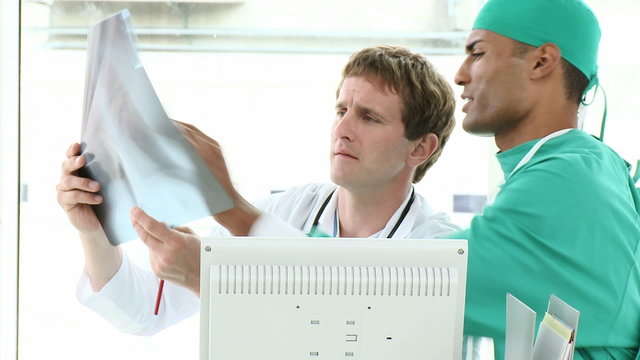 Surgeon and Doctor looking at an xray