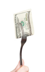 fork with hundred dollar bill close up