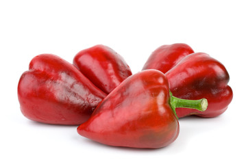Five red sweet peppers