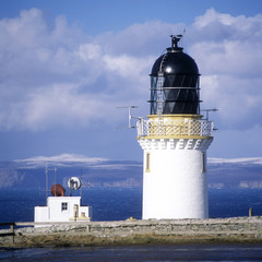 Fototapeta na wymiar lighthouse, Dunnet Head, Orkney Islands at the background, UK