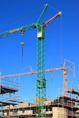 Baukrane, Krane, Hochbau, Hausbau, himmelblau