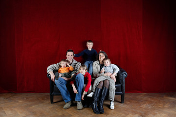 Fototapeta na wymiar happy family on the sofa
