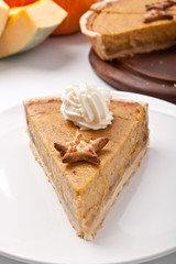 slice of Pumpkin pie with whipped cream
