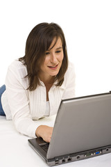 Attractive young lady working on a laptop computer