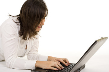 Attractive young lady working on a laptop computer