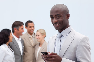 Smiling Afro-American businessman sending a message