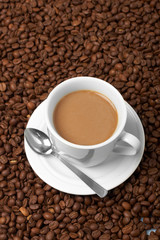 Cup with coffee, costing on coffee grain