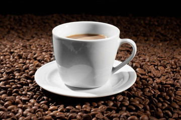 Cup with coffee, costing on coffee grain