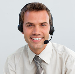 Portrait of a smiling businessman with a headset on