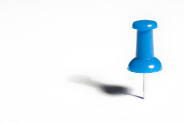 blue pushpin macro, isolated on white