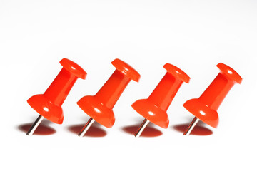 red pushpins macro, isolated on white