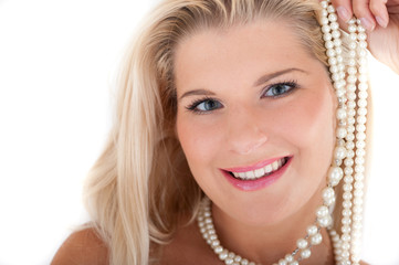 Young woman with healthy white teeth and pearls