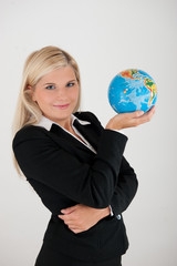 Young business woman with a globe