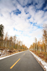straight road vanishing into distance .