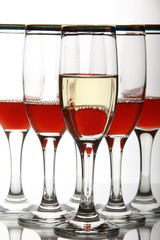 Glasswine with red wine on mirror table