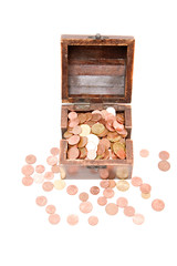 A wooden ancient chest full of money..