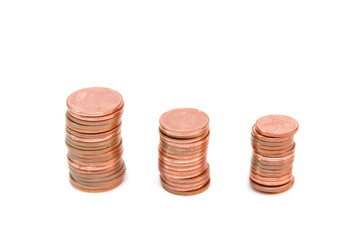 towers of golden coins isolated on white