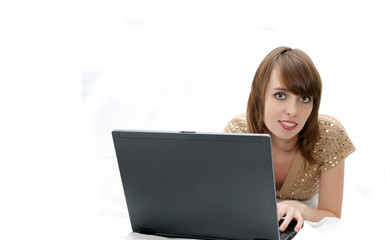 Smiling young girl with laptop isolated