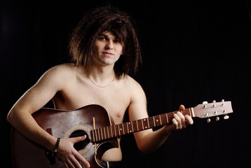 naked man with acoustic guitar tone