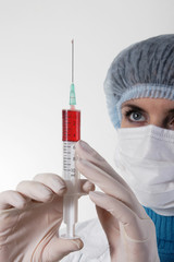 Medicine doctor with medical syringe in hands, A(H1N1)